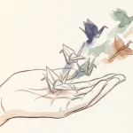 An elegant watercolor illustration of an open hand releasing paper origami cranes that dissolve into soft, colorful washes of ink.